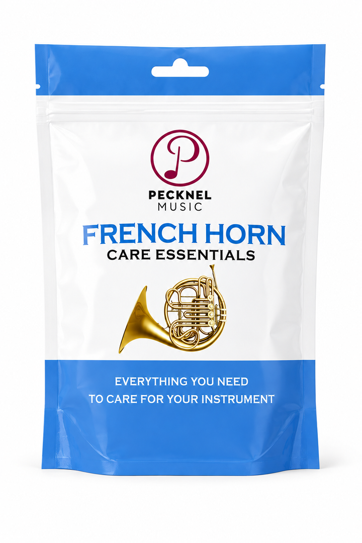 French horn care kit on white